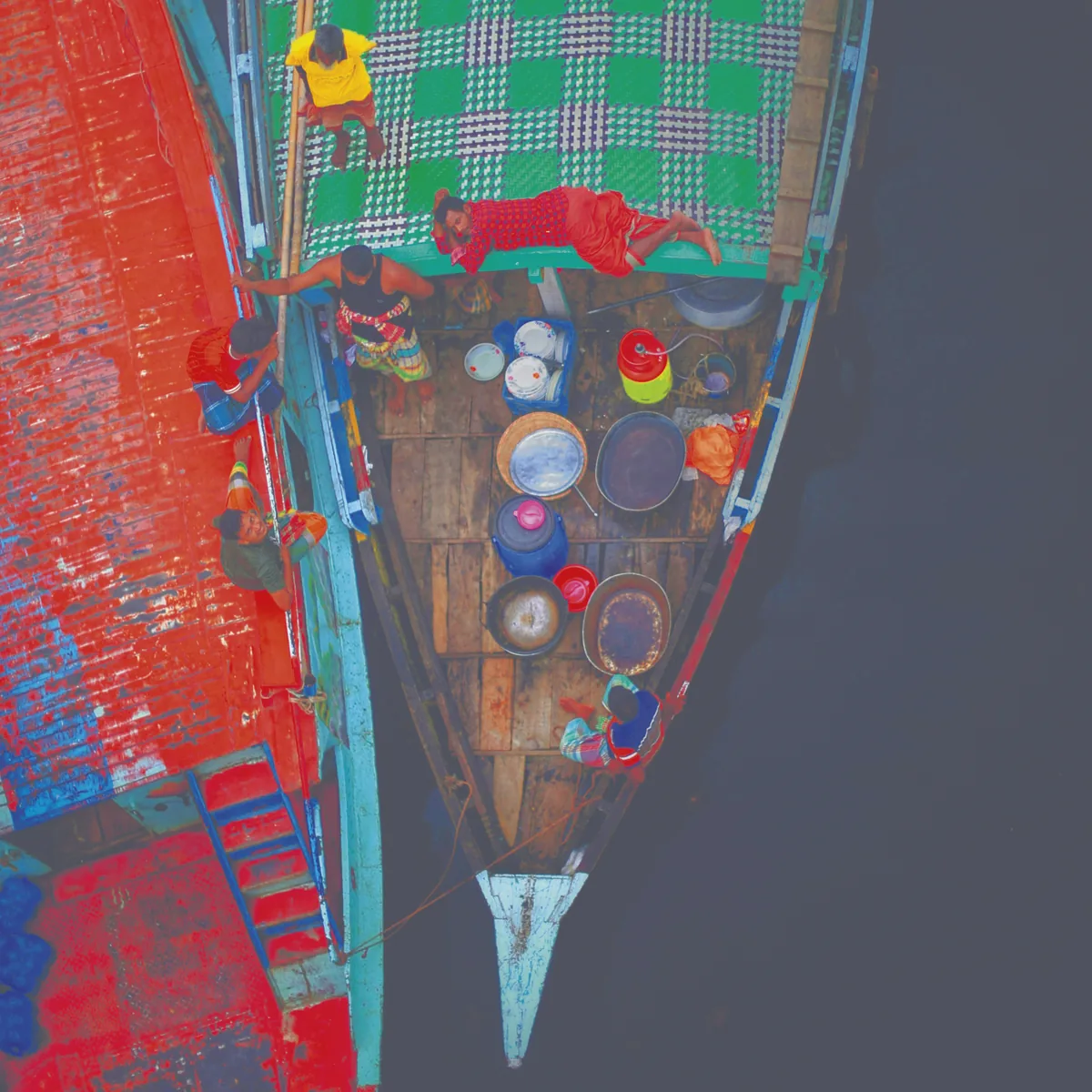 Cyan, magenta and yellow plates of the boat photo together, black left out, before GCR: the dark water is built from heavy CMY